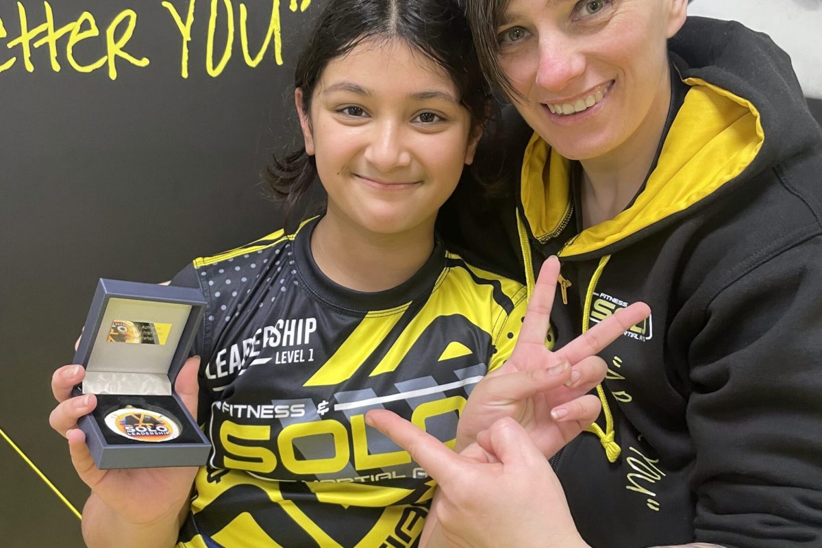 Young student earning Level 1 Leadership Medal at SOLO Martial Arts Academy in Newcastle upon Tyne.